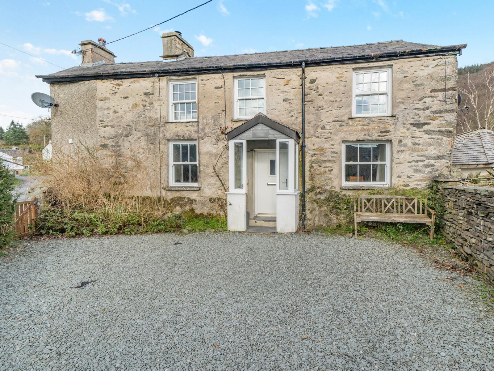 A closer up view of the front of the cottage from the driveway